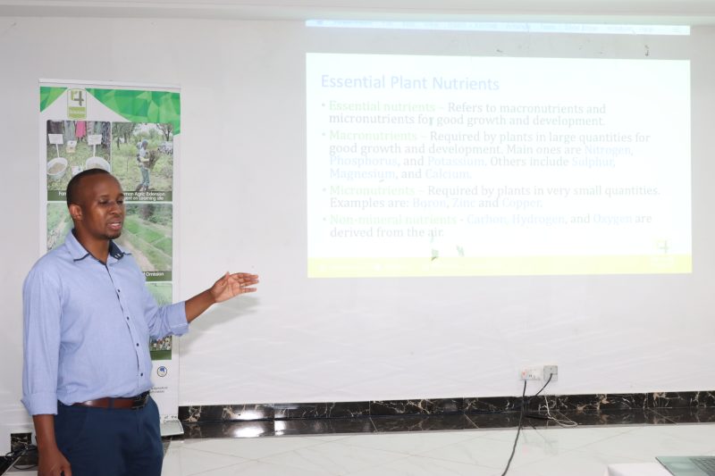 Instructor presenting an "Essential Plant Nutrients" slide in a classroom